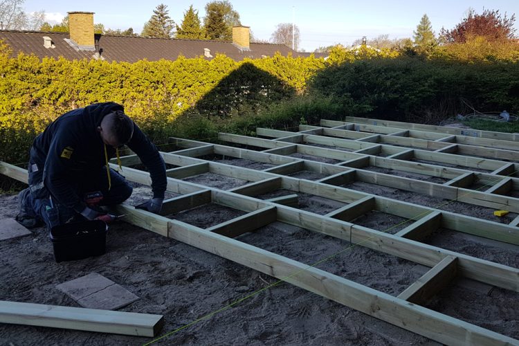 Carpenter building a foundation frame.